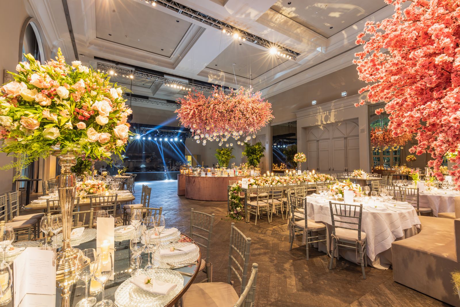 Luxury wedding reception with floral arrangements and warm lighting